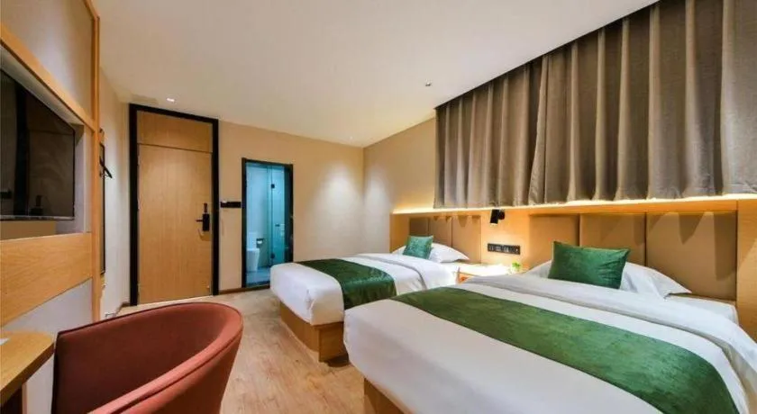 Bed in Echarm Hotel Kunming High-speed Railway South Station Chunrong Street Metro Station