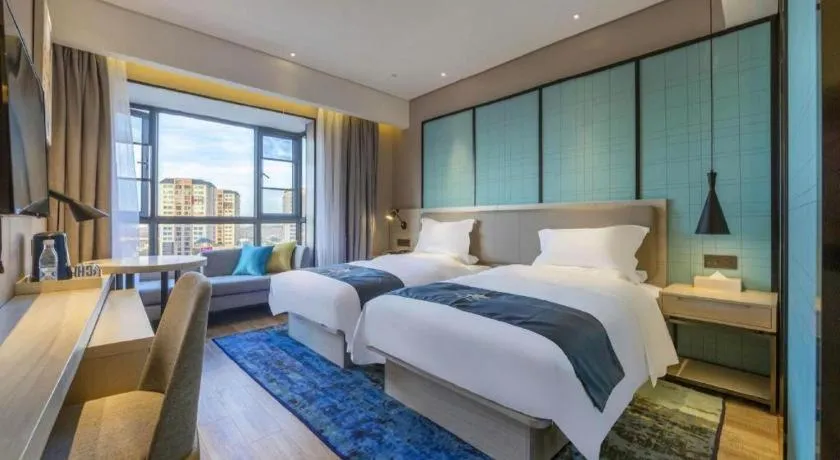 Bed in Echarm Hotel Kunming High-speed Railway South Station Chunrong Street Metro Station