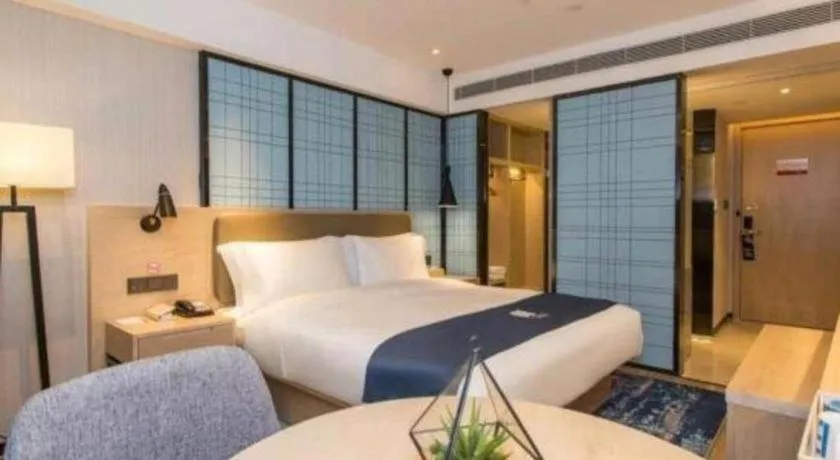 Bed in Echarm Hotel Kunming High-speed Railway South Station Chunrong Street Metro Station