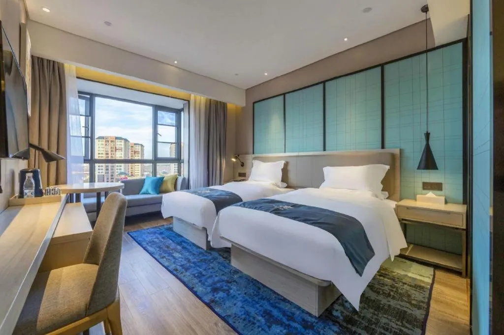 Bed in Echarm Hotel Kunming High-speed Railway South Station Chunrong Street Metro Station