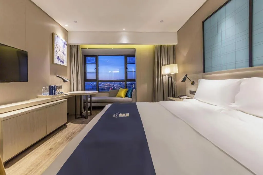 Bed in Echarm Hotel Kunming High-speed Railway South Station Chunrong Street Metro Station