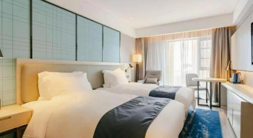 Bed in Echarm Hotel Kunming High-speed Railway South Station Chunrong Street Metro Station