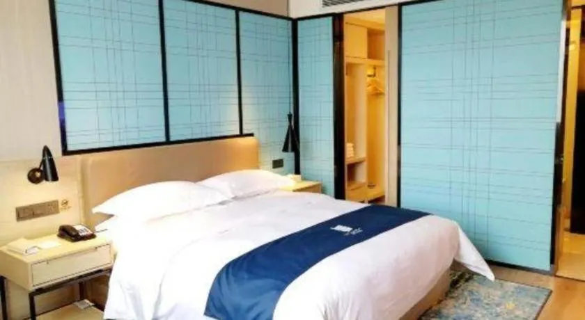 Bed in Echarm Hotel Kunming High-speed Railway South Station Chunrong Street Metro Station
