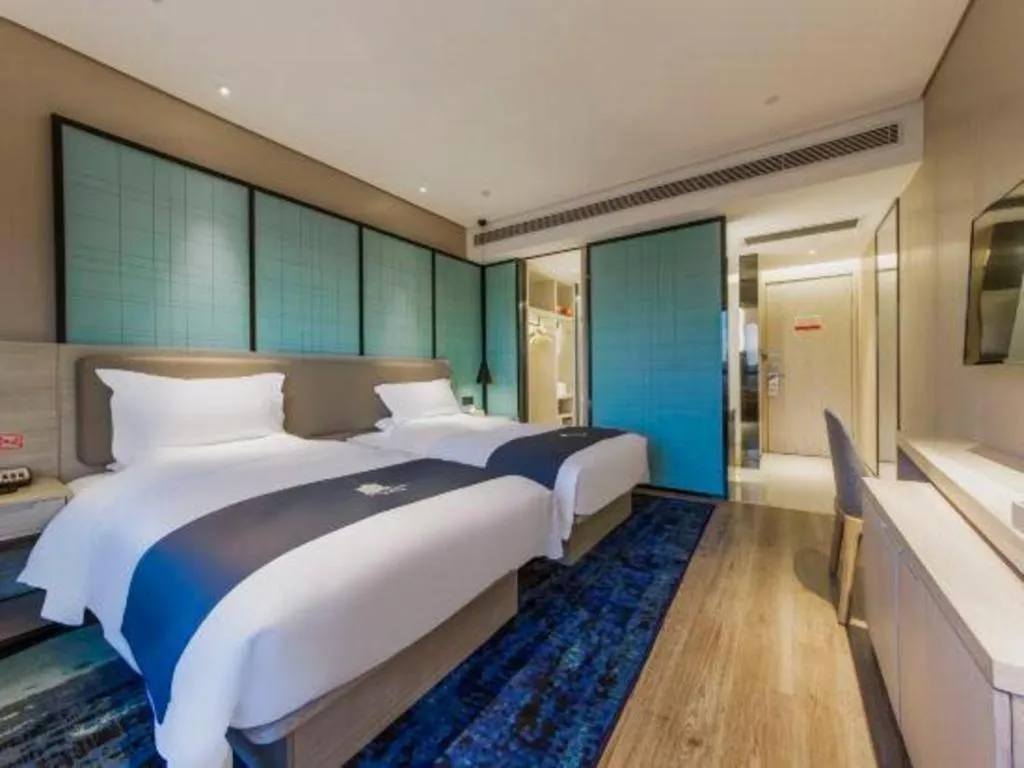 Bed in Echarm Hotel Kunming High-speed Railway South Station Chunrong Street Metro Station