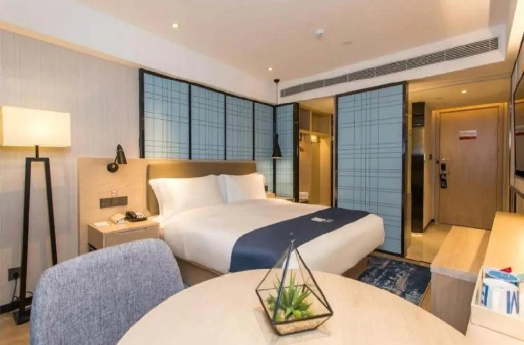 Bed in Echarm Hotel Kunming High-speed Railway South Station Chunrong Street Metro Station