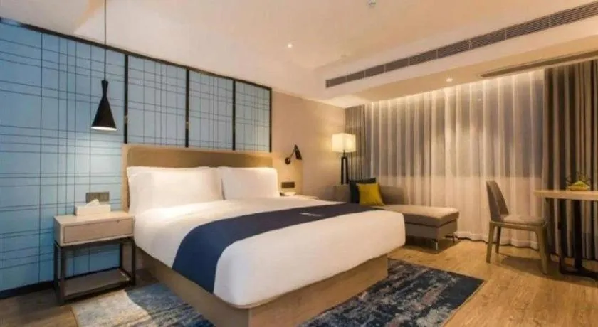 Bed in Echarm Hotel Kunming High-speed Railway South Station Chunrong Street Metro Station