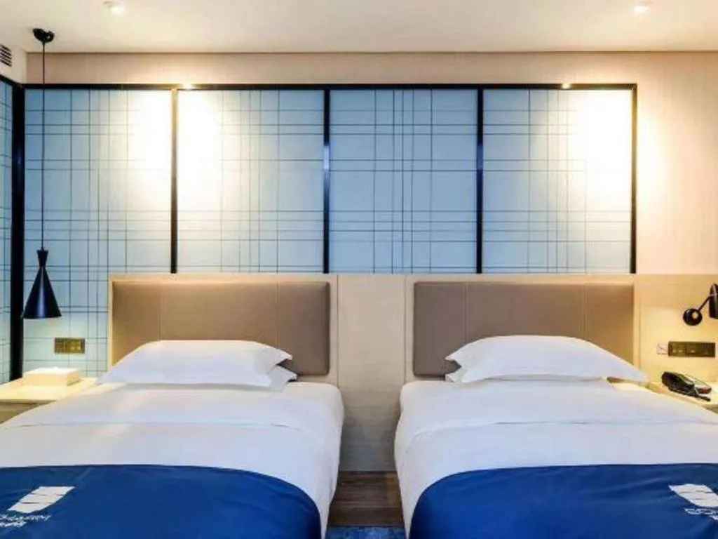 Bed in Echarm Hotel Kunming High-speed Railway South Station Chunrong Street Metro Station