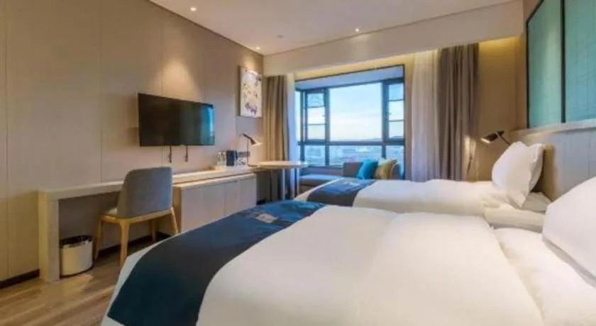 Bed in Echarm Hotel Kunming High-speed Railway South Station Chunrong Street Metro Station