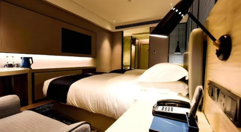 Bed in Echarm Hotel Kunming High-speed Railway South Station Chunrong Street Metro Station