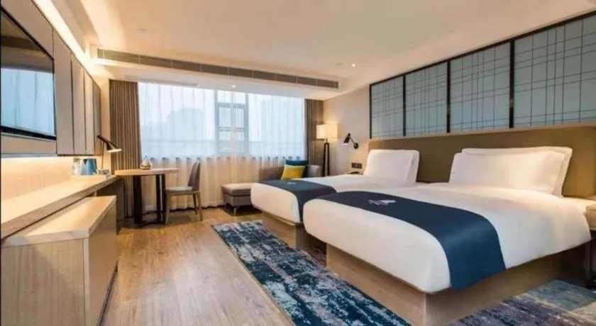 Bed in Echarm Hotel Kunming High-speed Railway South Station Chunrong Street Metro Station