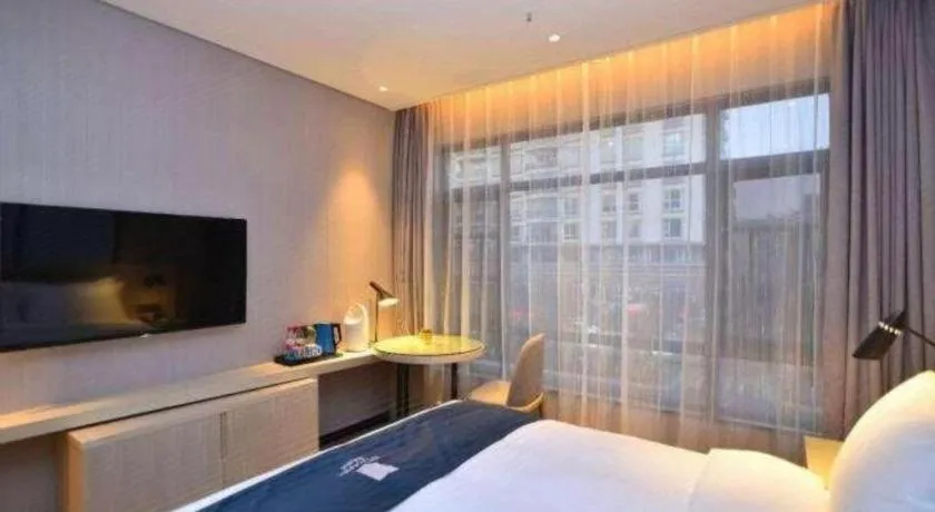 Bed in Echarm Hotel Kunming High-speed Railway South Station Chunrong Street Metro Station