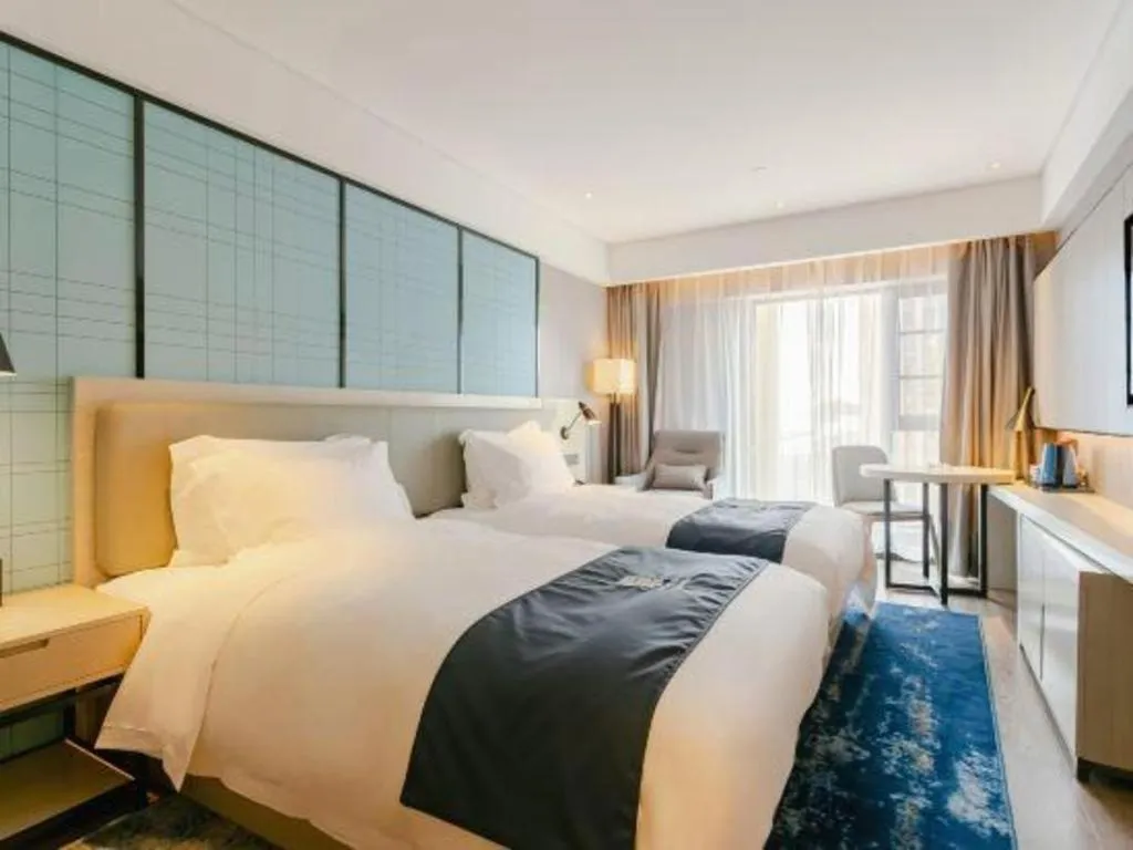 Bed in Echarm Hotel Kunming High-speed Railway South Station Chunrong Street Metro Station