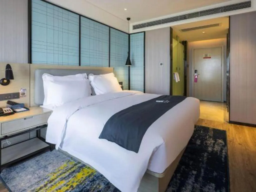 Bed in Echarm Hotel Kunming High-speed Railway South Station Chunrong Street Metro Station