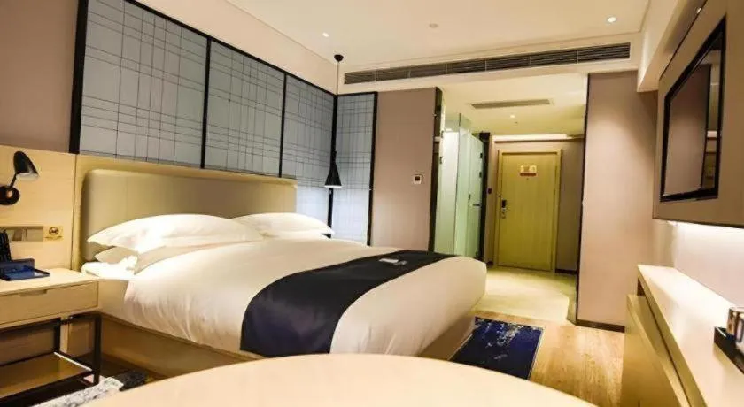 Bed in Echarm Hotel Kunming High-speed Railway South Station Chunrong Street Metro Station