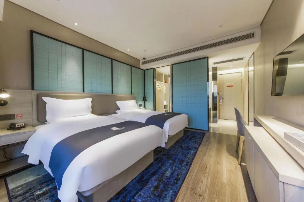 Bed in Echarm Hotel Kunming High-speed Railway South Station Chunrong Street Metro Station