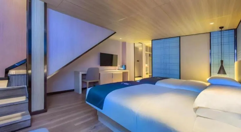 Bed in Echarm Hotel Guiyang Qianling Mountain