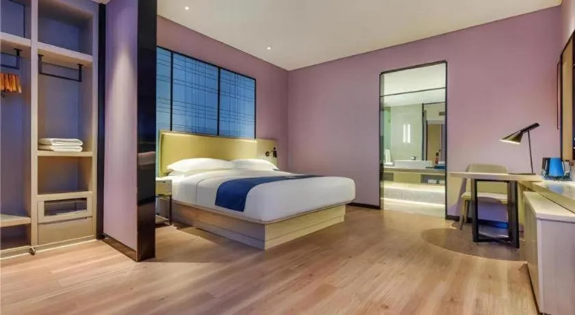 Bed in Echarm Hotel Guiyang Qianling Mountain