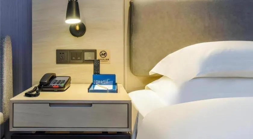 Bed in Echarm Hotel Guiyang Qianling Mountain