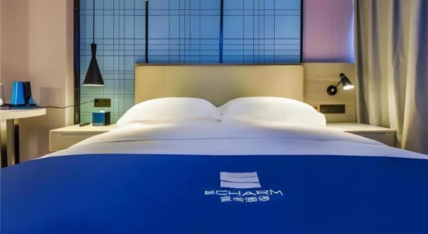 Bed in Echarm Hotel Guiyang Qianling Mountain