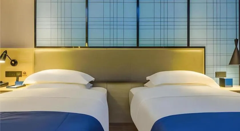 Bed in Echarm Hotel Guiyang Qianling Mountain