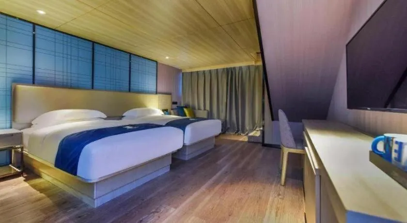 Bed in Echarm Hotel Guiyang Qianling Mountain