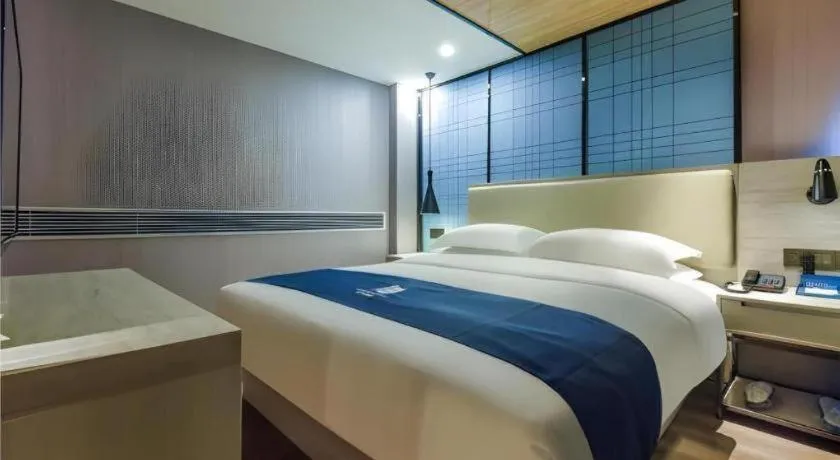 Bed in Echarm Hotel Guiyang Qianling Mountain