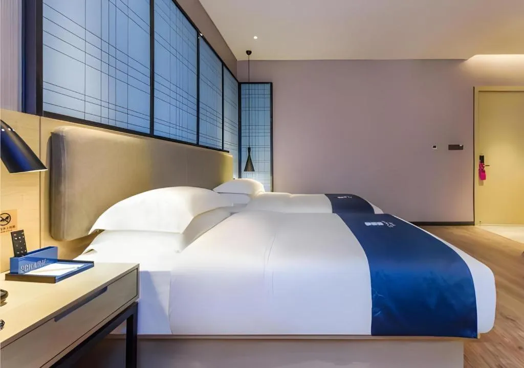 Bed in Echarm Hotel Guiyang Qianling Mountain