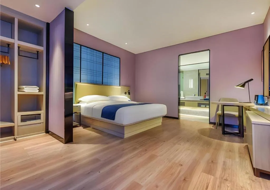 Bed in Echarm Hotel Guiyang Qianling Mountain