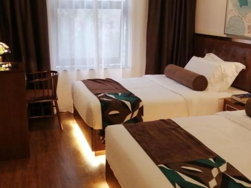 Bed in James Joyce Coffetel Guilin Railway Station Xiangbi Mountain Liangjiang Sihu Wharf