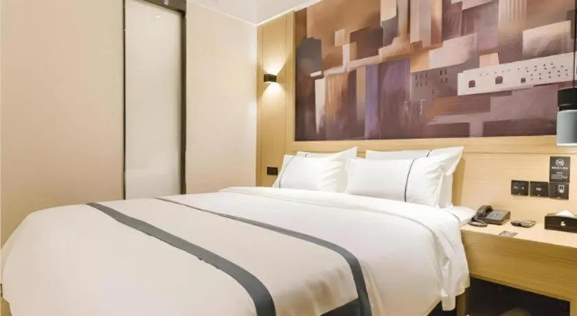 Bed in City Comfort Inn Foshan Sanshui Datang