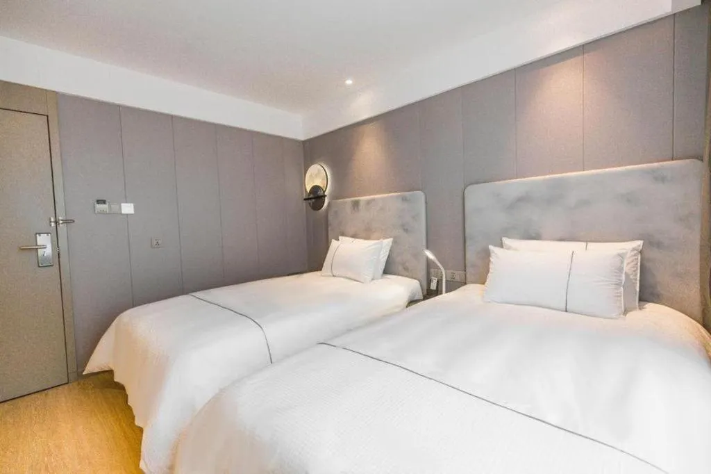 Bed in Magnotel Hotel Huangshan Scenic Area Transfer Center