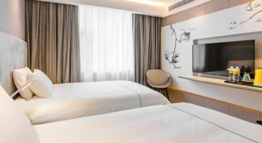 Bed in Magnotel Hotel Huangshan Scenic Area Transfer Center