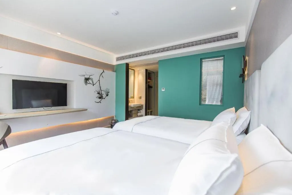 Bed in Magnotel Hotel Huangshan Scenic Area Transfer Center