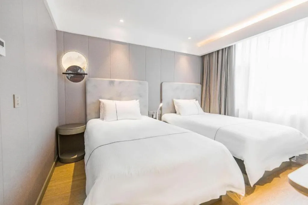 Bed in Magnotel Hotel Huangshan Scenic Area Transfer Center