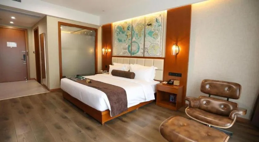 Bed in James Joyce Coffetel Xinyang Municipal Government Railway Station