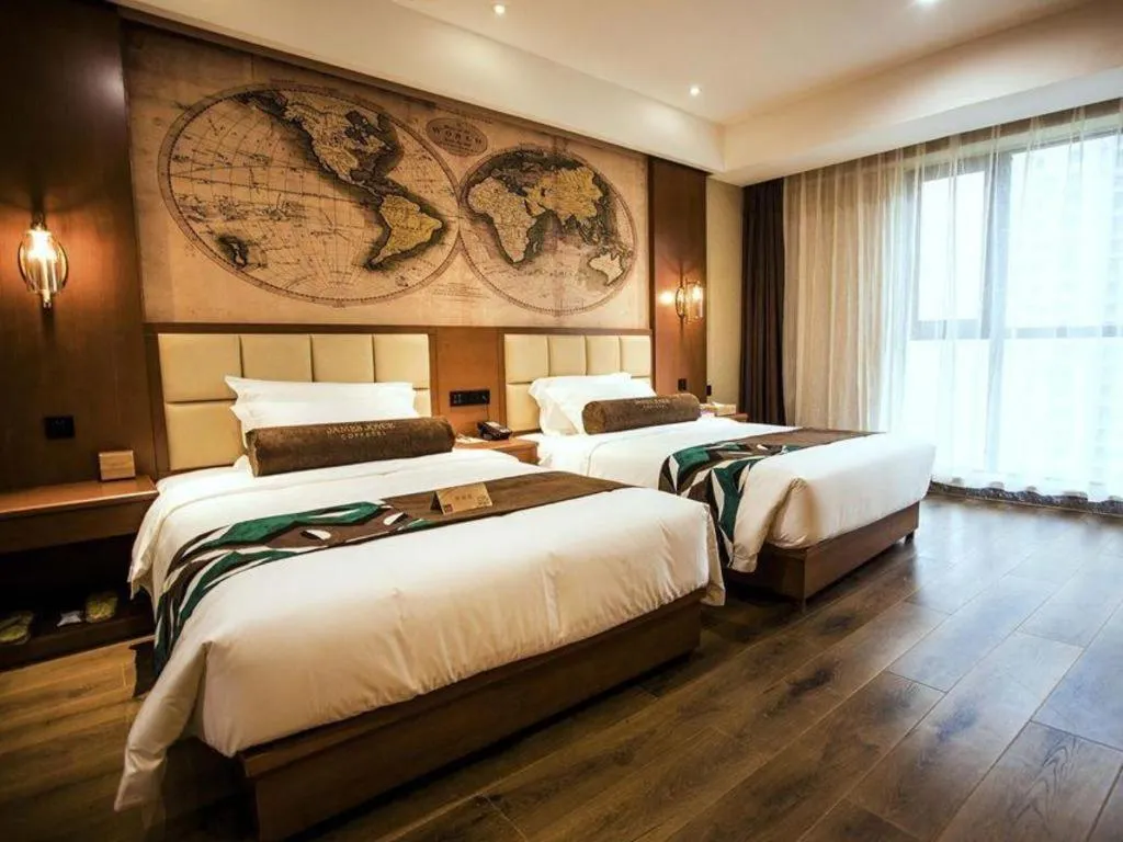 Bed in James Joyce Coffetel Xinyang Municipal Government Railway Station