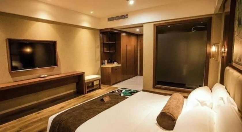 Bed in James Joyce Coffetel Xinyang Municipal Government Railway Station