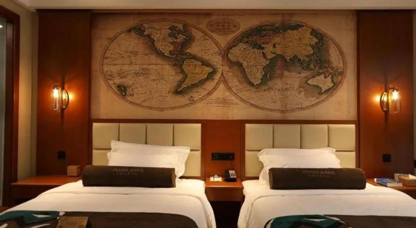 Bed in James Joyce Coffetel Xinyang Municipal Government Railway Station