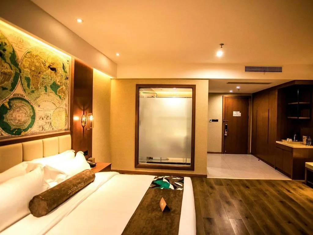 Bed in James Joyce Coffetel Xinyang Municipal Government Railway Station