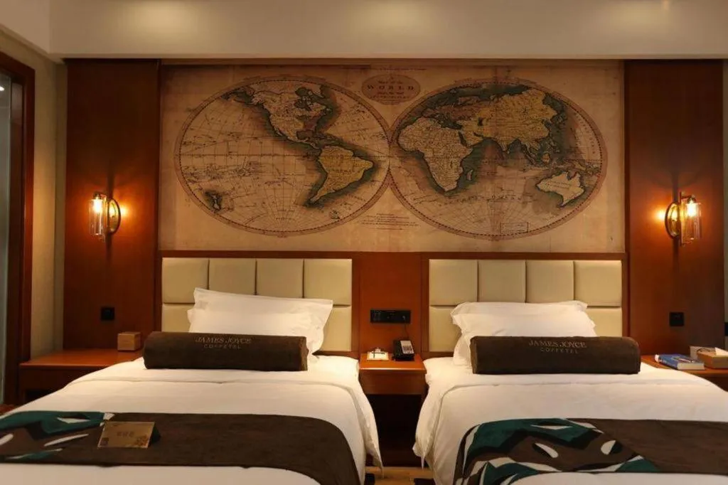 Bed in James Joyce Coffetel Xinyang Municipal Government Railway Station