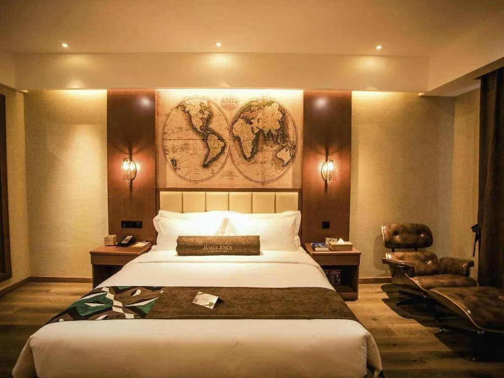 Bed in James Joyce Coffetel Xinyang Municipal Government Railway Station