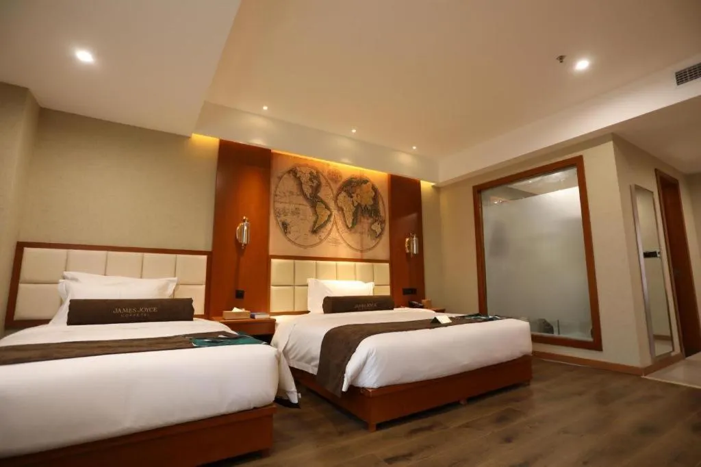 Bed in James Joyce Coffetel Xinyang Municipal Government Railway Station