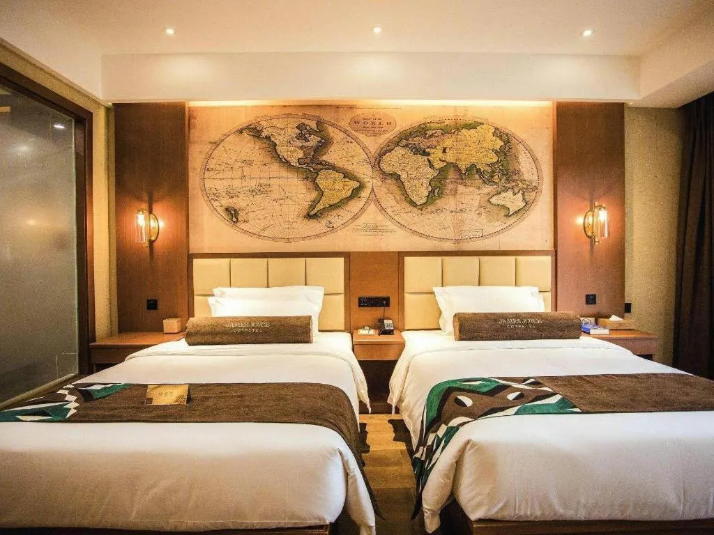 Bed in James Joyce Coffetel Xinyang Municipal Government Railway Station