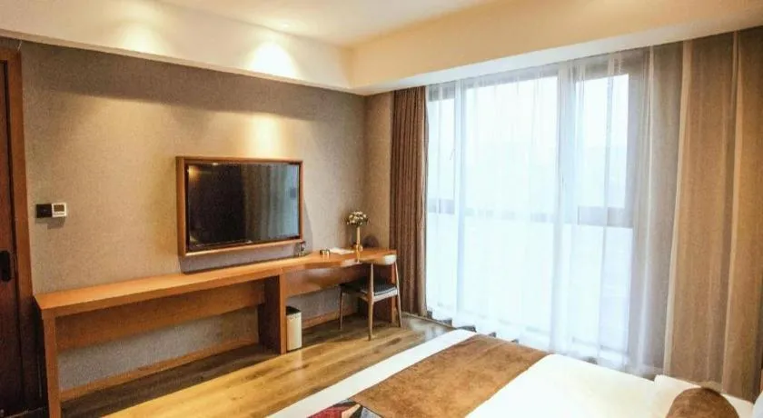 Bed in James Joyce Coffetel Xinyang Municipal Government Railway Station