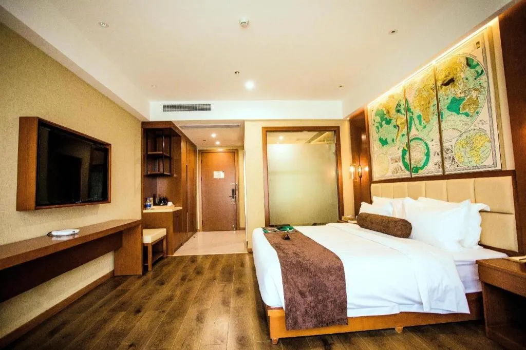 Bed in James Joyce Coffetel Xinyang Municipal Government Railway Station