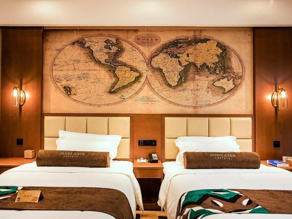 Bed in James Joyce Coffetel Xinyang Municipal Government Railway Station