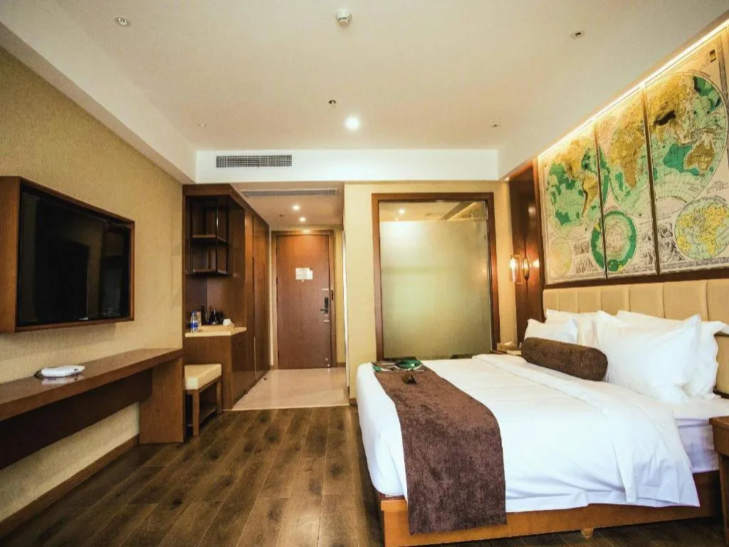 Bed in James Joyce Coffetel Xinyang Municipal Government Railway Station