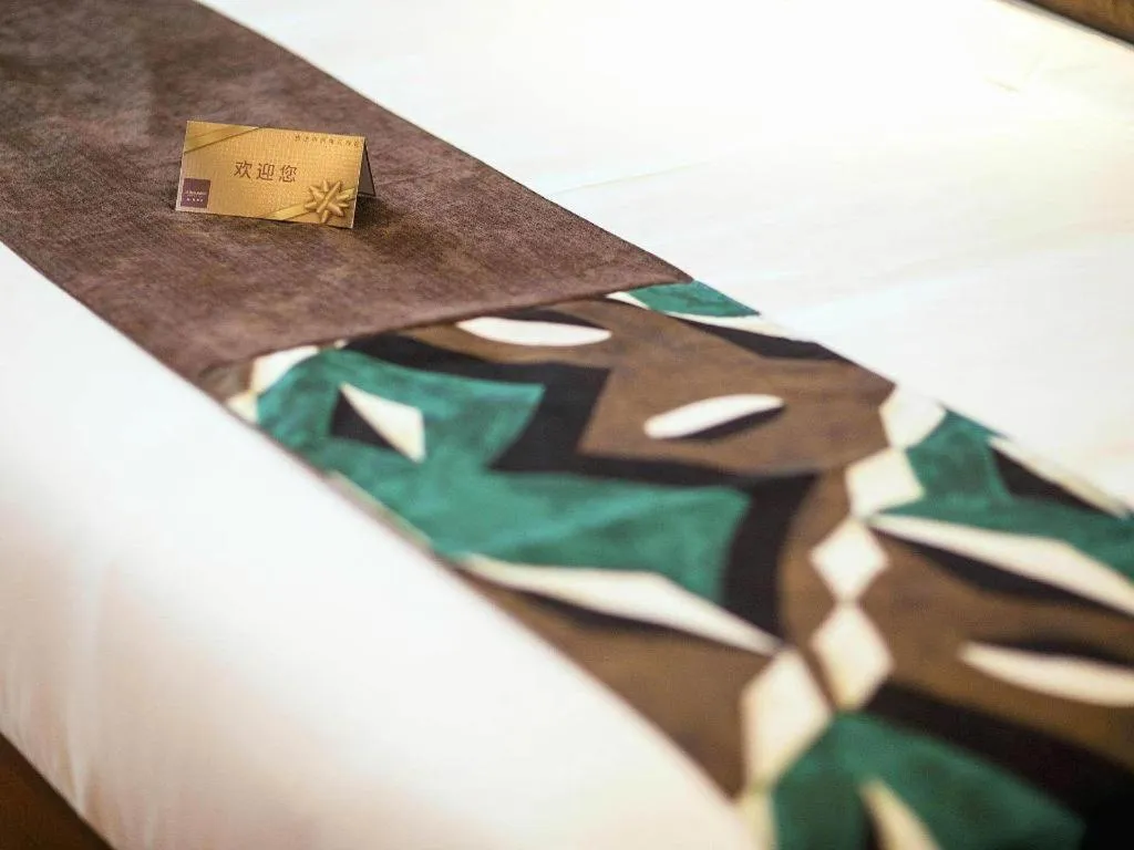 Bed in James Joyce Coffetel Xinyang Municipal Government Railway Station