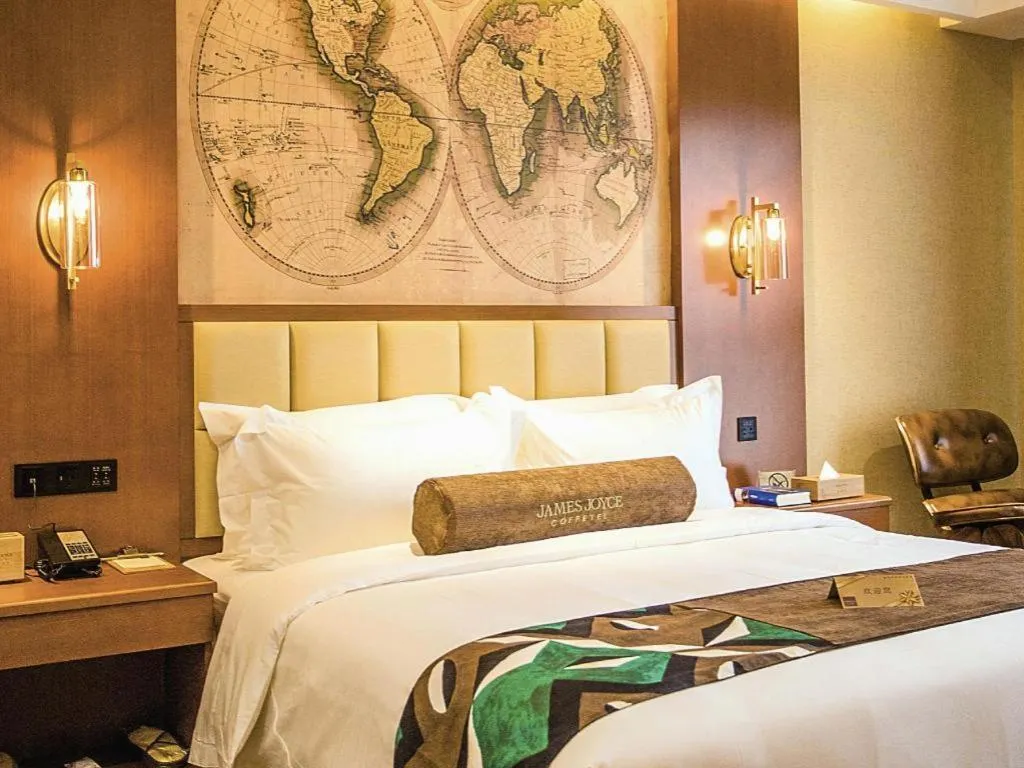 Bed in James Joyce Coffetel Xinyang Municipal Government Railway Station