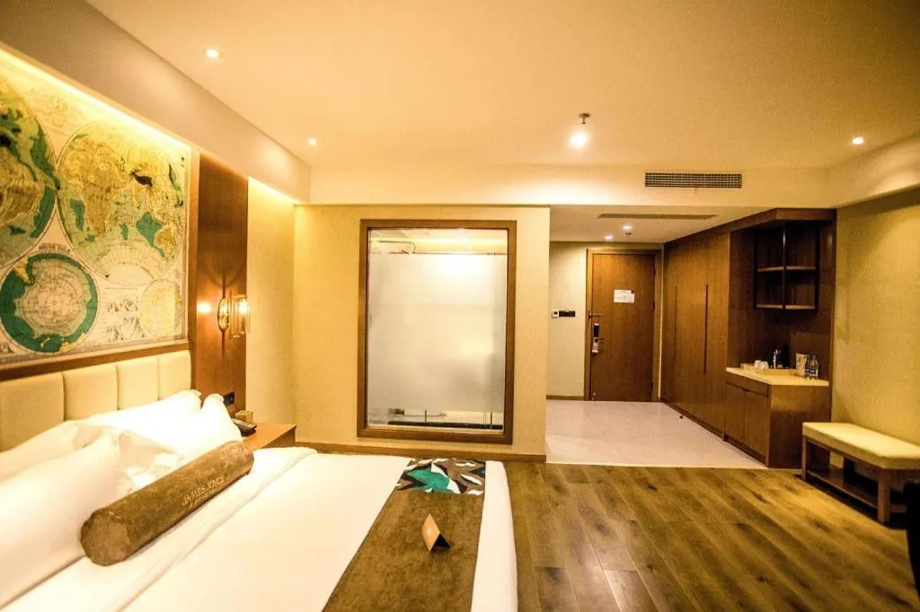 Bed in James Joyce Coffetel Xinyang Municipal Government Railway Station